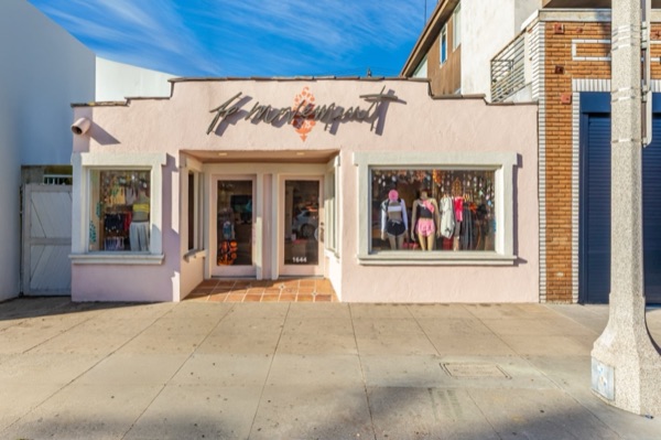 Former FP Movement storefront on Abbot Kinney Boulevard, a pink single-story building, now vacant