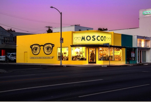 Former MOSCOT storefront at Melrose and Edinburgh at dusk, now leased